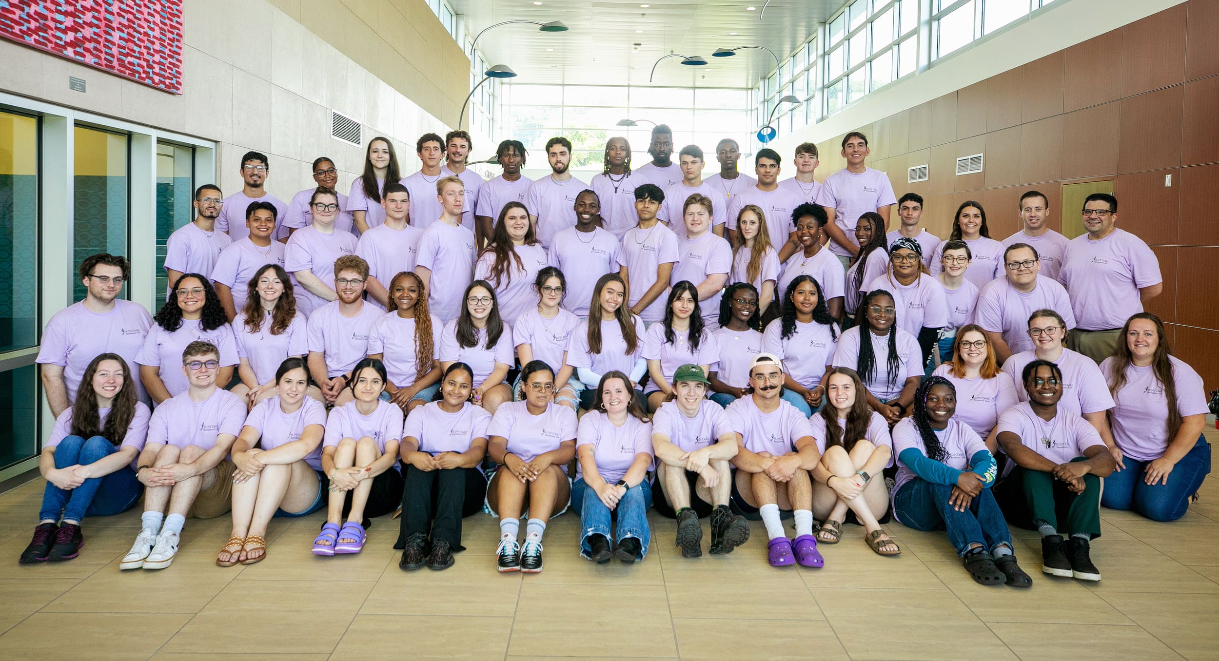 Students socializing in the entrance to Catskill Hall